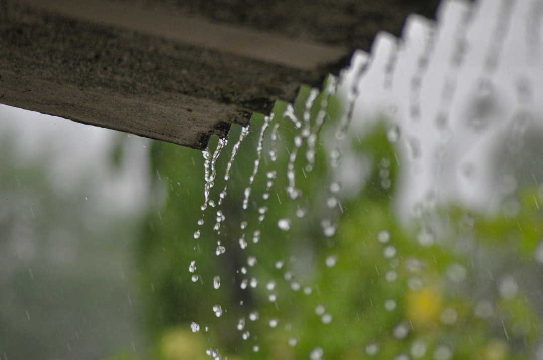 gutter seams leaking during rainstorm water damage home exterior